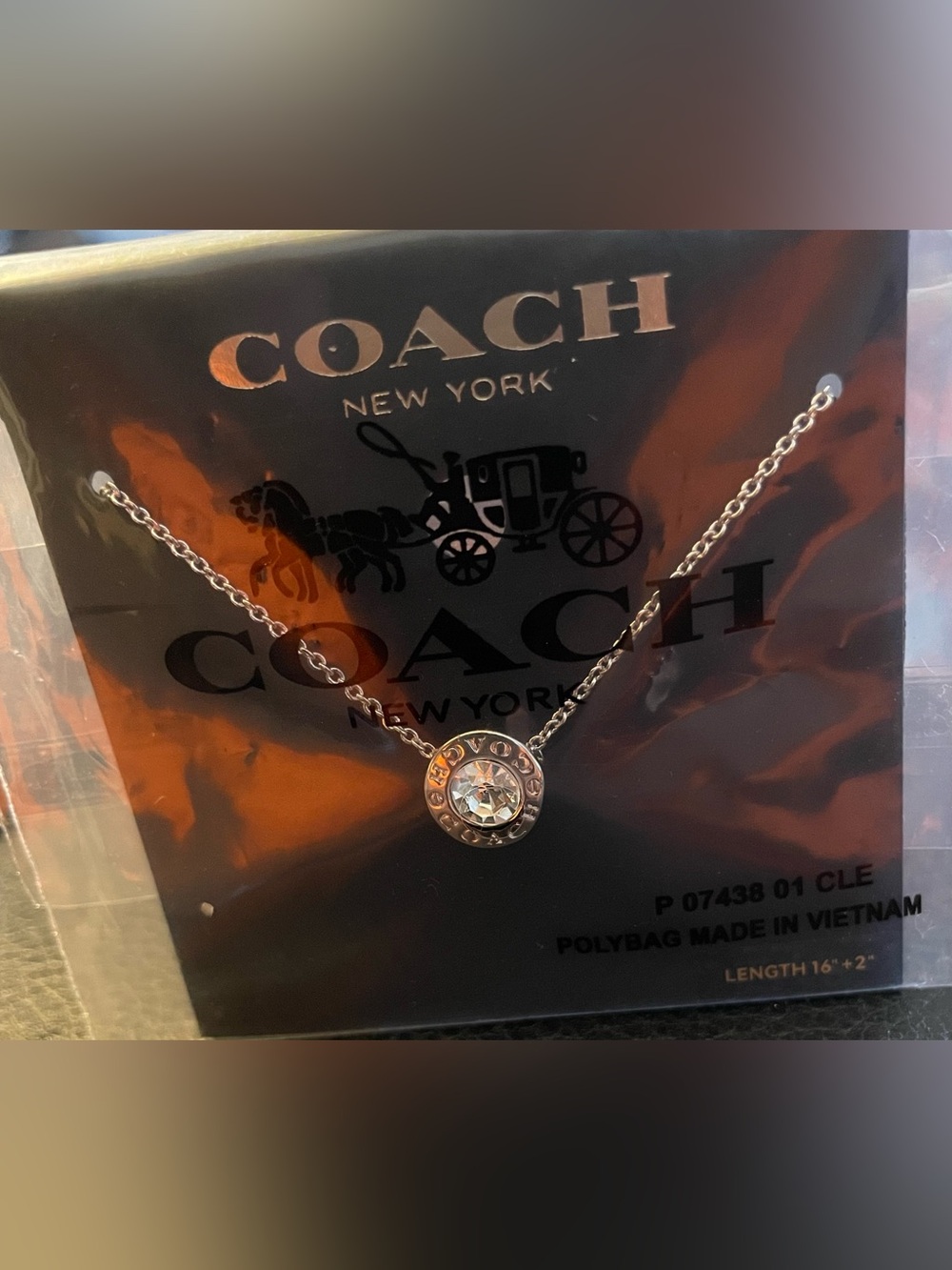 Coach Silver-Tone Crystal Disk Pendant Necklace
